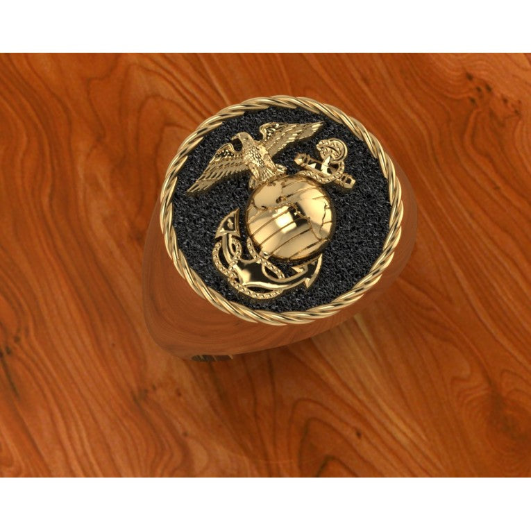 GOLD 3_4 INCH WIDE MARINE CORPS RING WITH BLACK BACKGROUND
